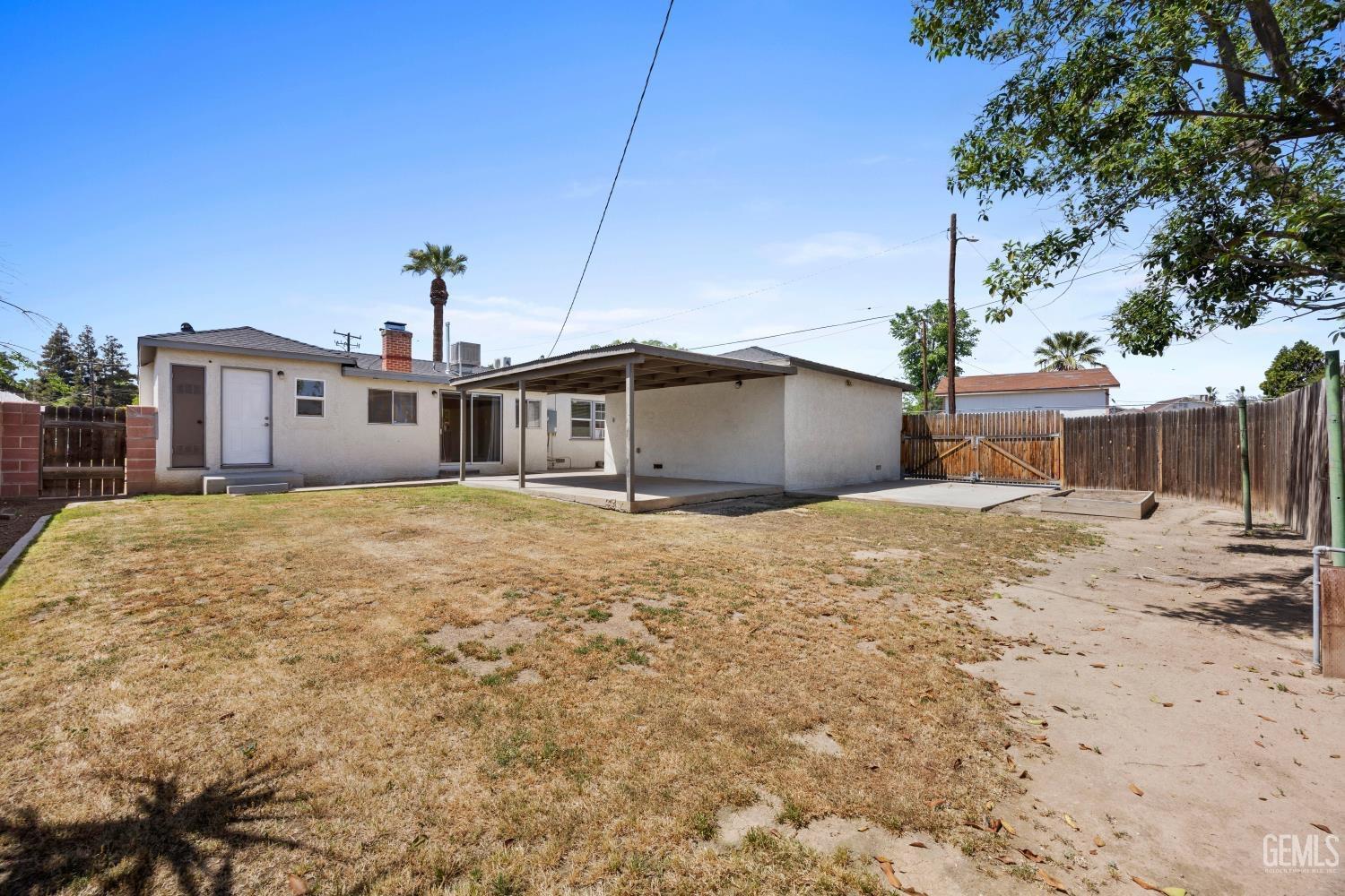 Undisclosed Address Bakersfield, CA 93305 - Photo 28 of 29 a front view of a house with a yard