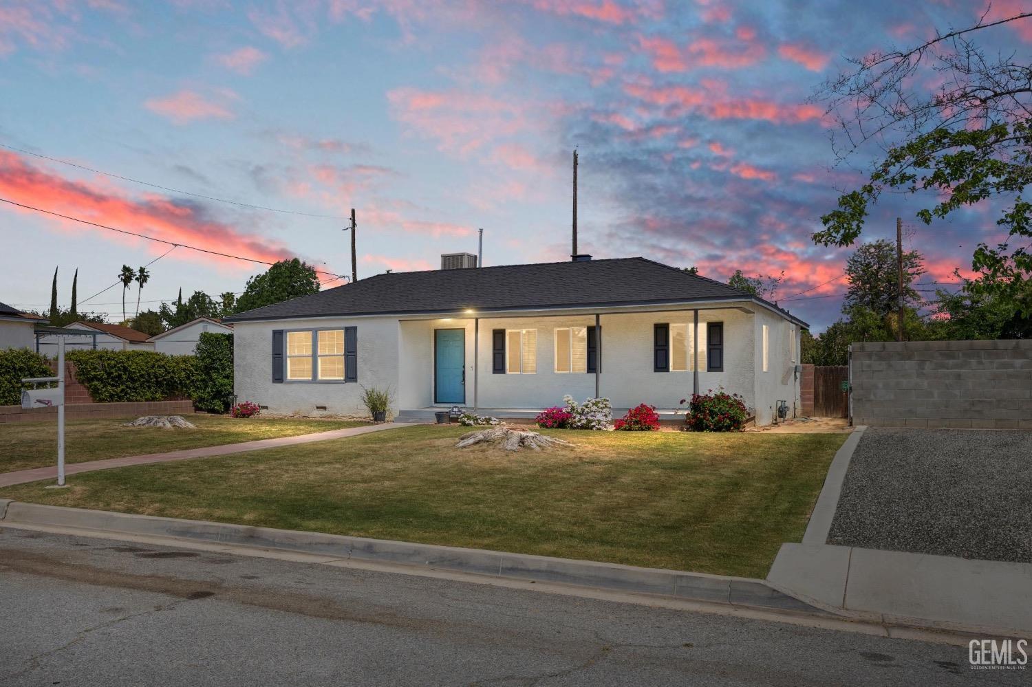Undisclosed Address Bakersfield, CA 93305 - Photo 3 of 29 a front view of a house with a yard