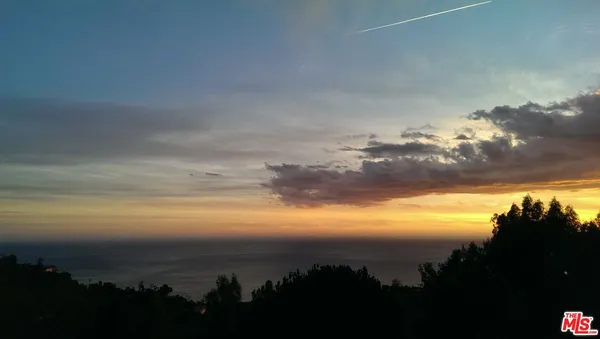 a utility room with a glass door and shower
