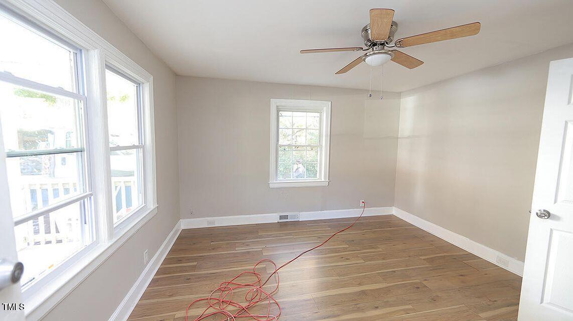 615 Arnette Avenue Durham, NC 27701 - Photo 7 of 13 a view of an empty room with a window