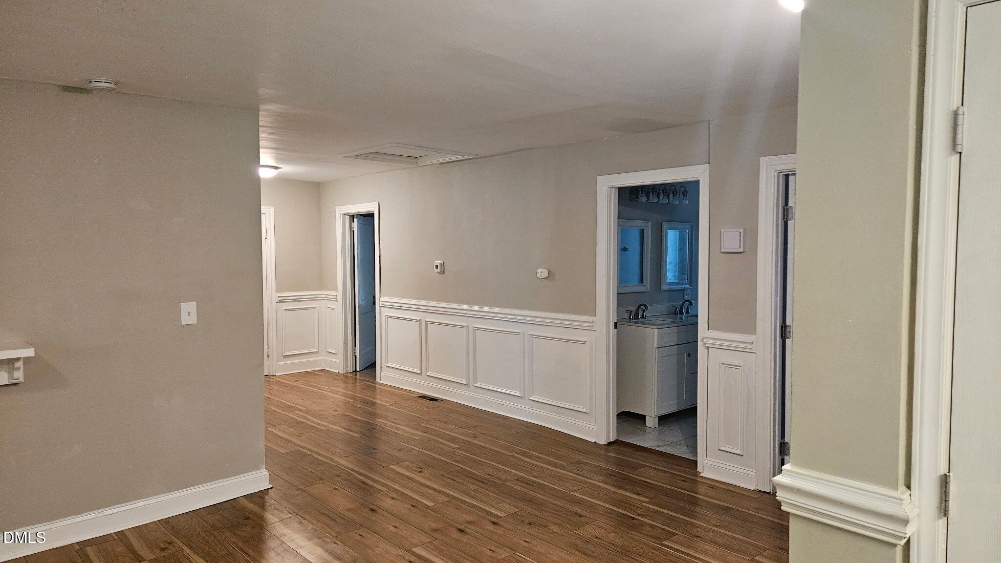 615 Arnette Avenue Durham, NC 27701 - Photo 10 of 13 wooden floor with white walls