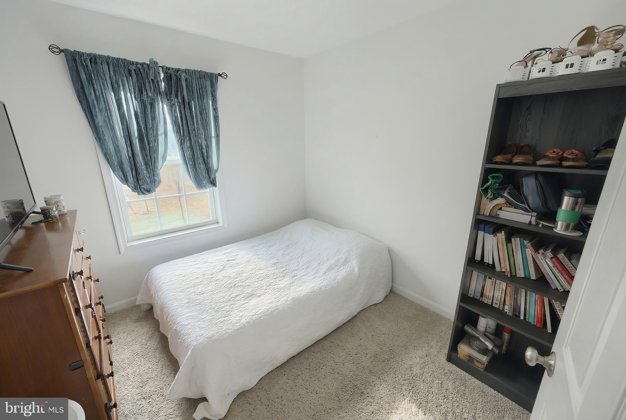 31 Winslow Ct. Gettysburg, PA 17325 - Photo 19 of 45 a bedroom with a bed and a book shelf