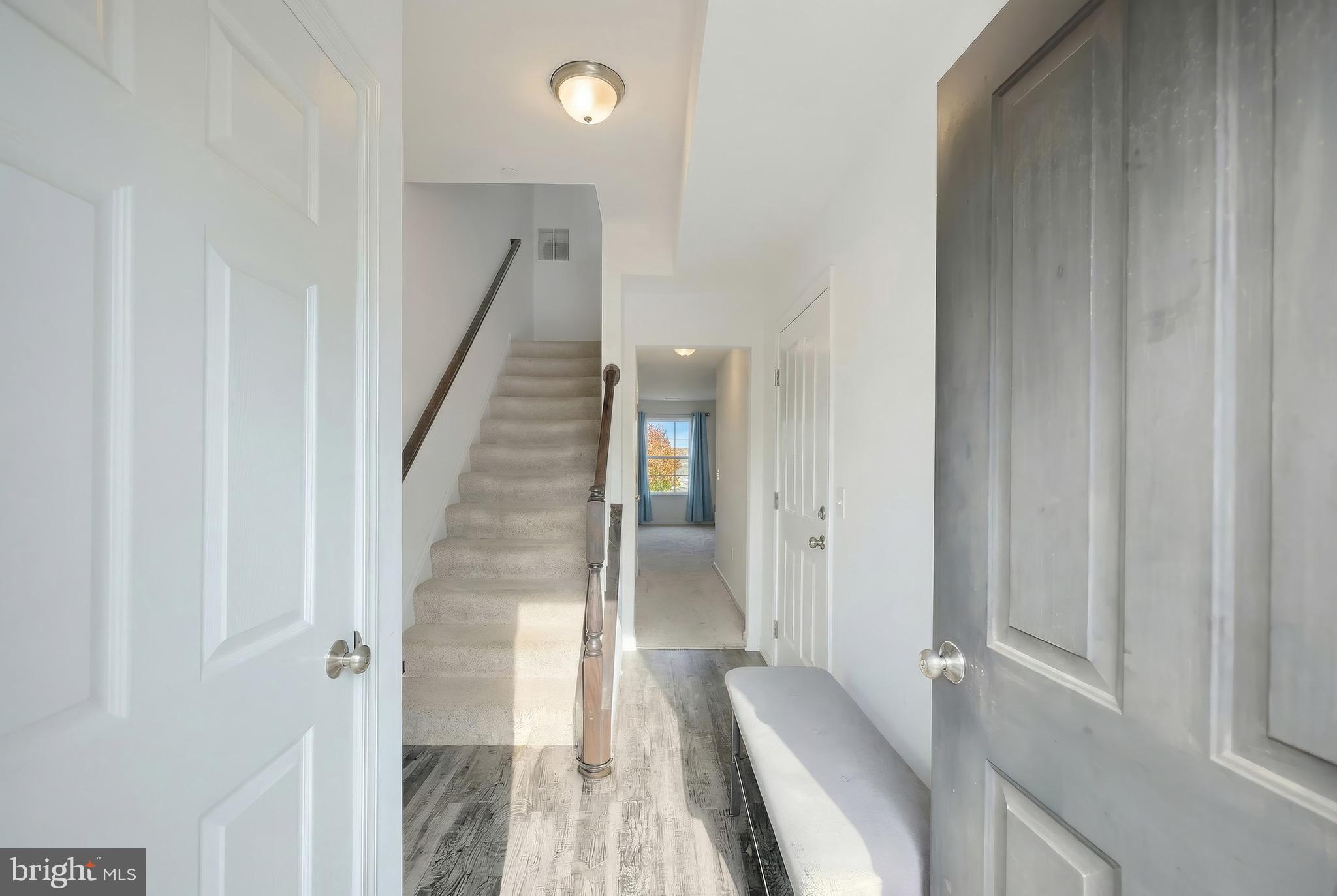 31 Winslow Ct. Gettysburg, PA 17325 - Photo 5 of 45 a view of a hallway with wooden floor and staircase