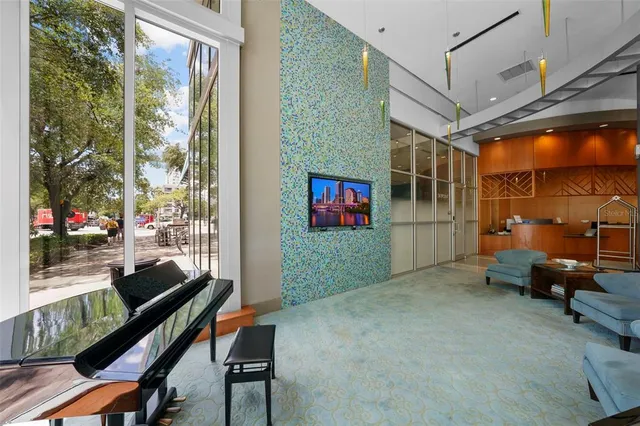 a swimming pool with outdoor seating and city view