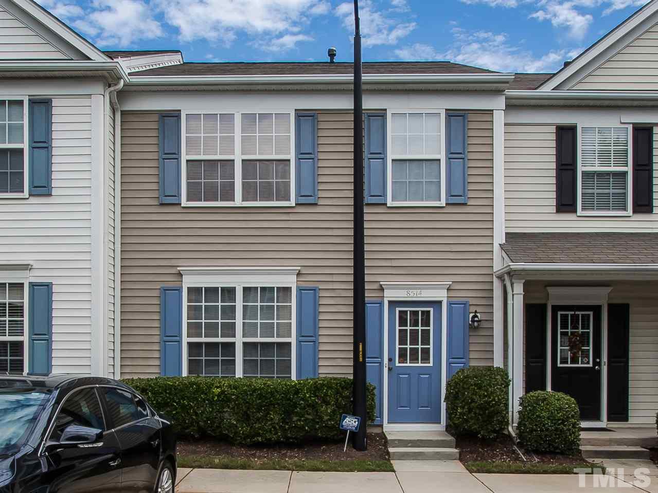 8514 Bright Loop Raleigh, NC 27613 - Photo 1 of 20 a view of a house with a large window and potted plants