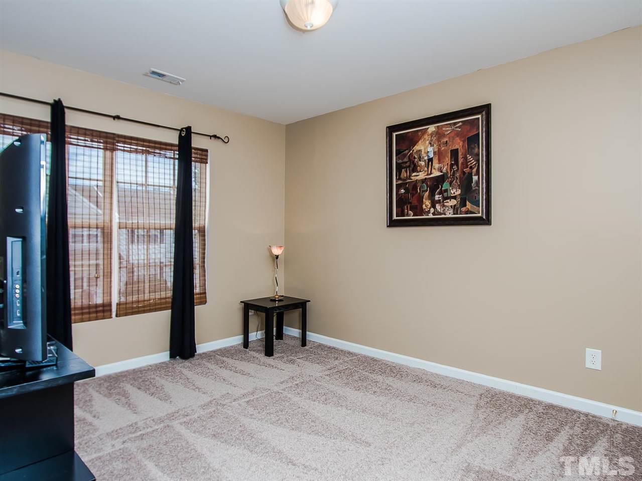 8514 Bright Loop Raleigh, NC 27613 - Photo 16 of 20 an empty room with windows and closet