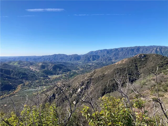 a view of mountains and valleys