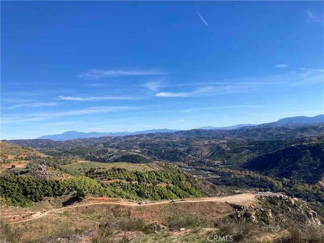 a view of a city with mountains in the background