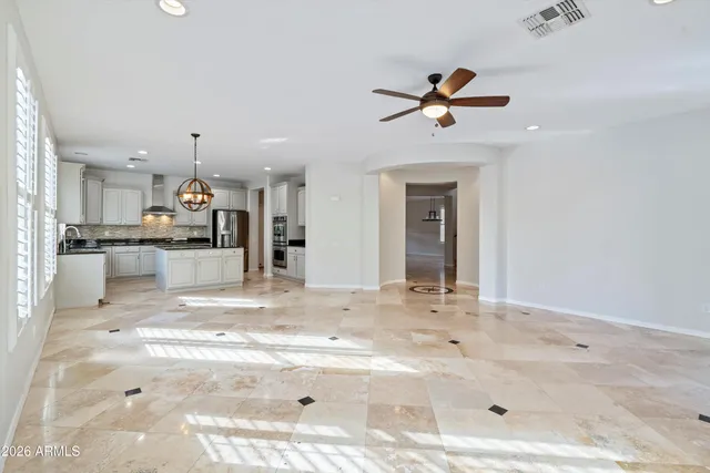 a view of a kitchen with a sink and cabinets