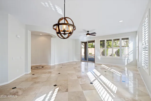a kitchen with granite countertop a stove sink and refrigerator