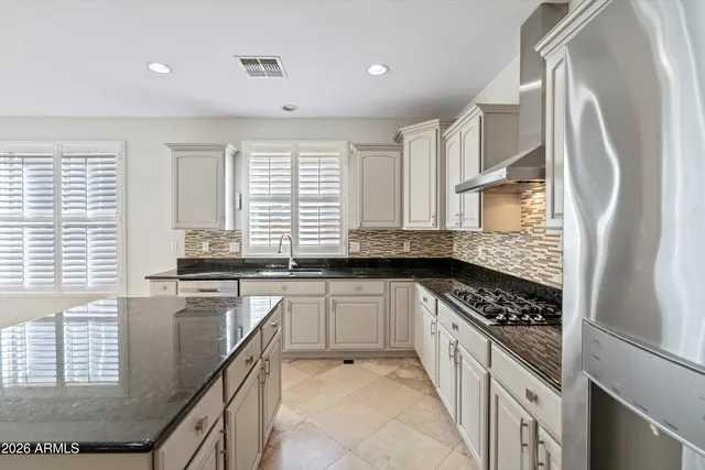 a view of a hallway with a kitchen space