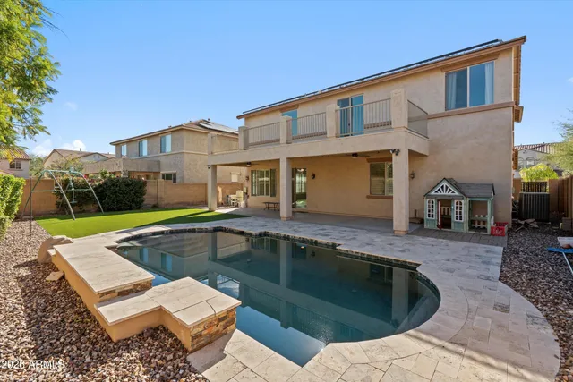 an aerial view of a house with a garden