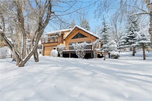 a view of a house with snow on the road