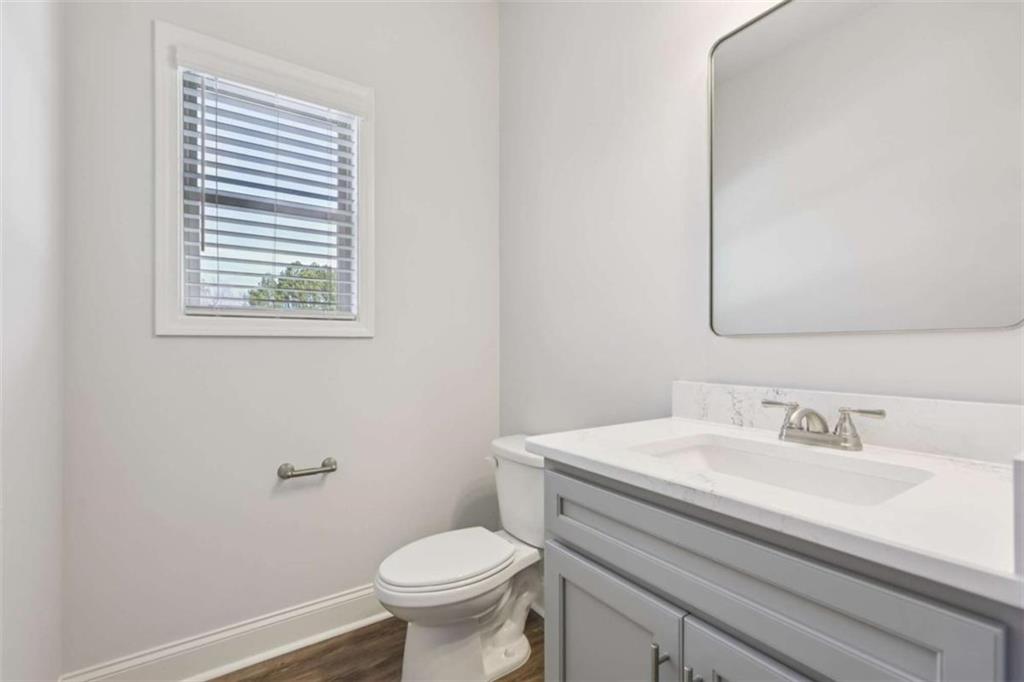1833 Millstone Manor Conyers, GA 30013 - Photo 20 of 50 a bathroom with a sink toilet and a mirror