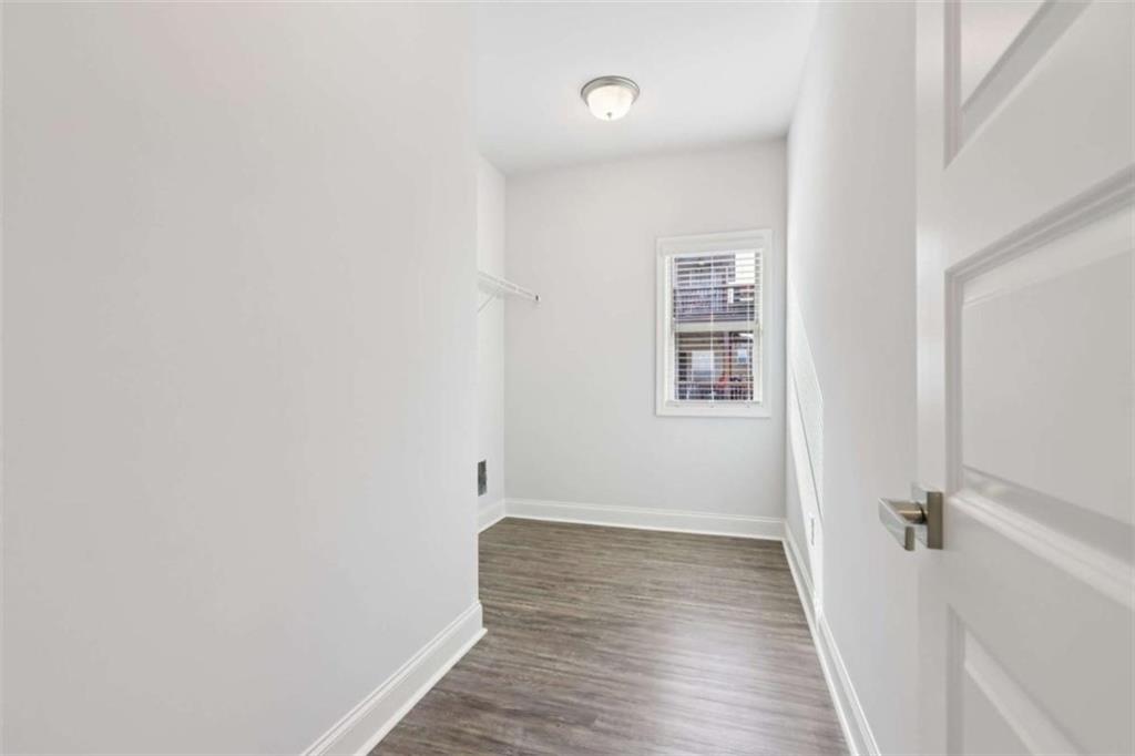 1833 Millstone Manor Conyers, GA 30013 - Photo 26 of 50 a view of a room with wooden floor
