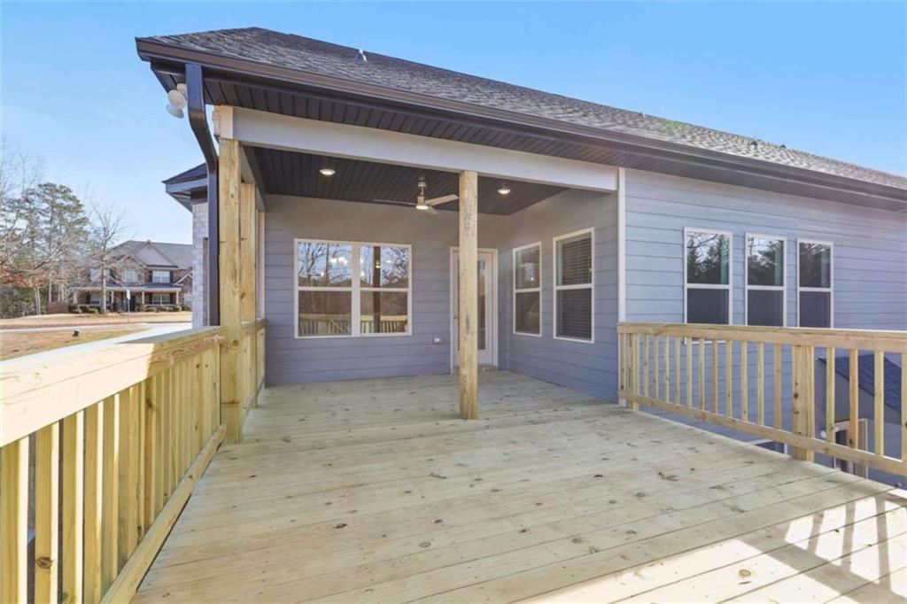 1833 Millstone Manor Conyers, GA 30013 - Photo 38 of 50 a view of a house with wooden fence