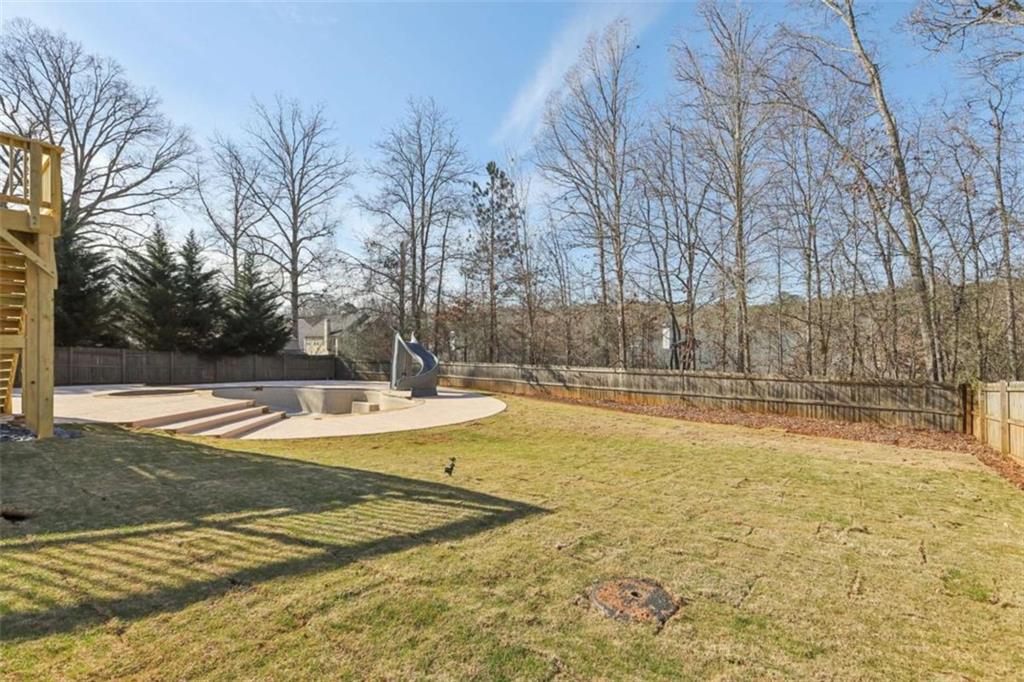 1833 Millstone Manor Conyers, GA 30013 - Photo 43 of 50 a view of a swimming pool with an outdoor space