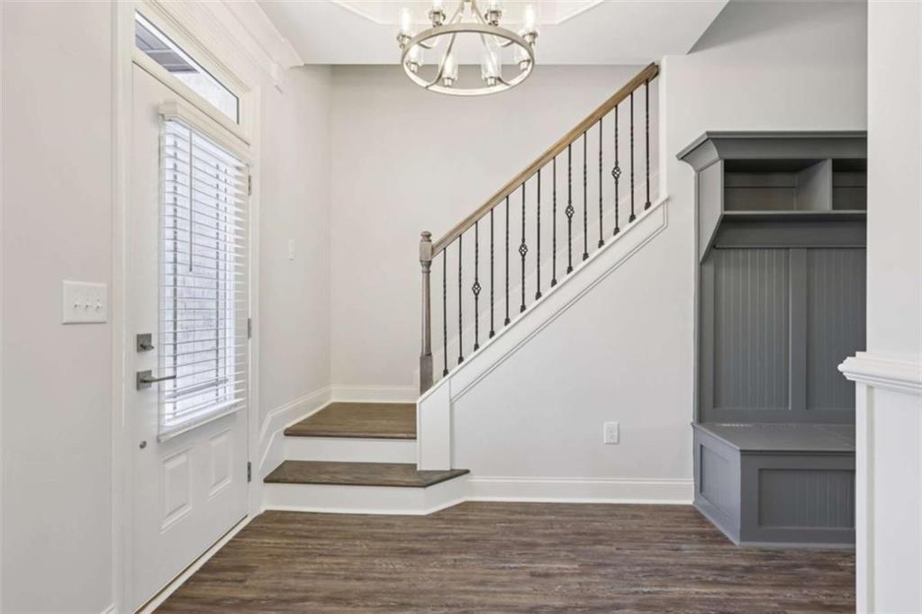 1833 Millstone Manor Conyers, GA 30013 - Photo 5 of 50 a view of entryway and hall with wooden floor