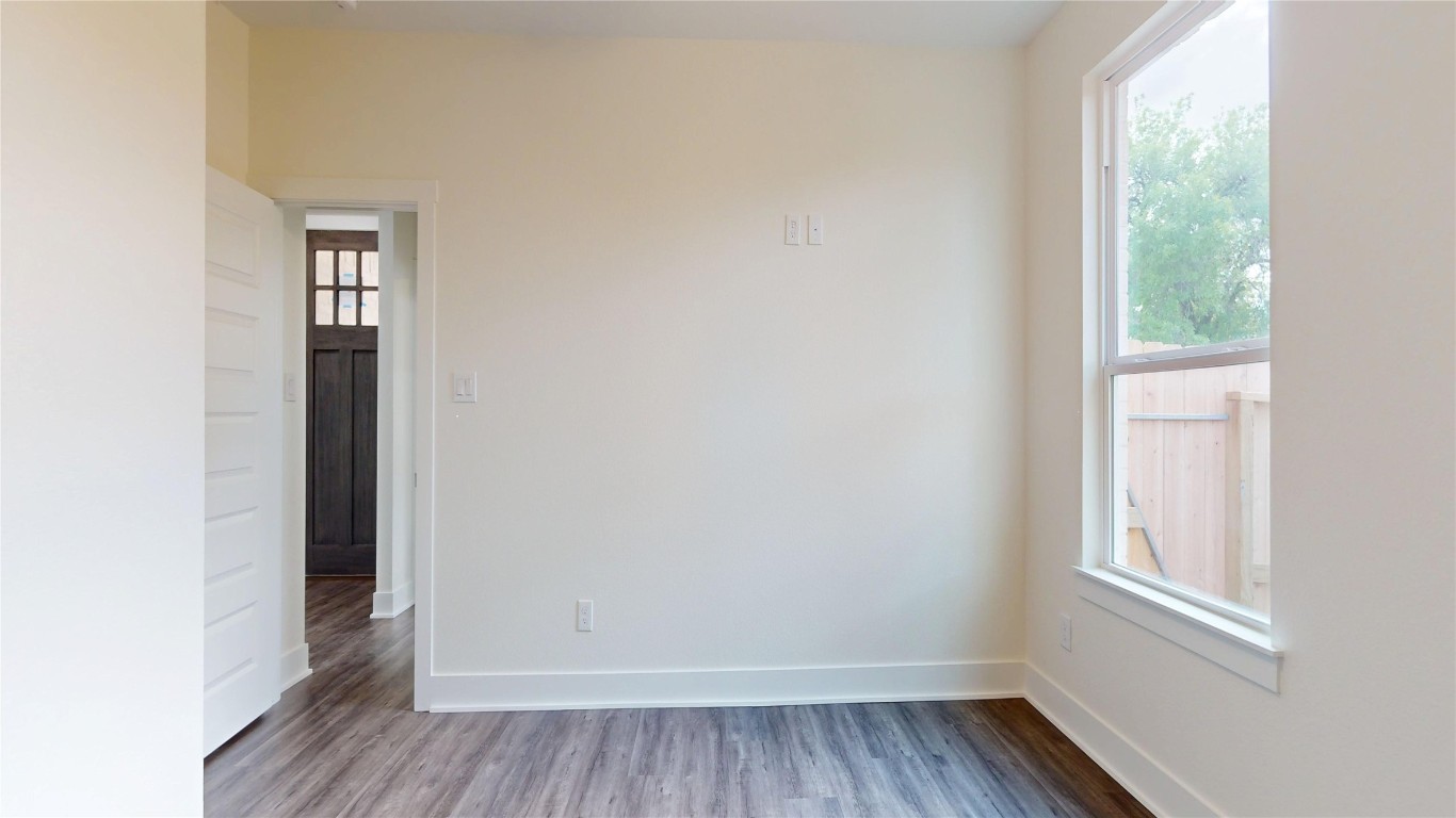 5119 Selinsky Road Houston, TX 77048 - Photo 14 of 45 an empty room with wooden floor and windows
