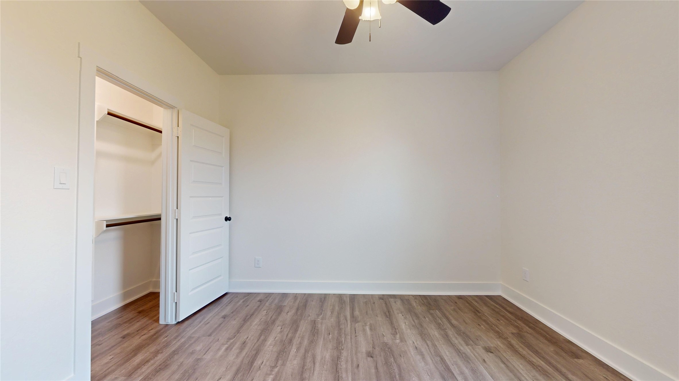 5119 Selinsky Road Houston, TX 77048 - Photo 16 of 45 a view of an empty room with wooden floor