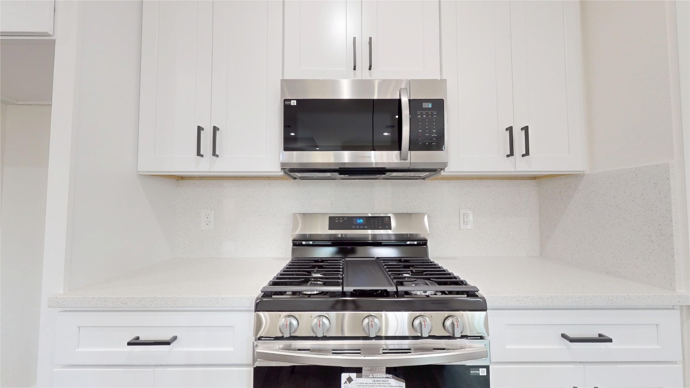 5119 Selinsky Road Houston, TX 77048 - Photo 22 of 45 a stove top oven sitting inside of a kitchen