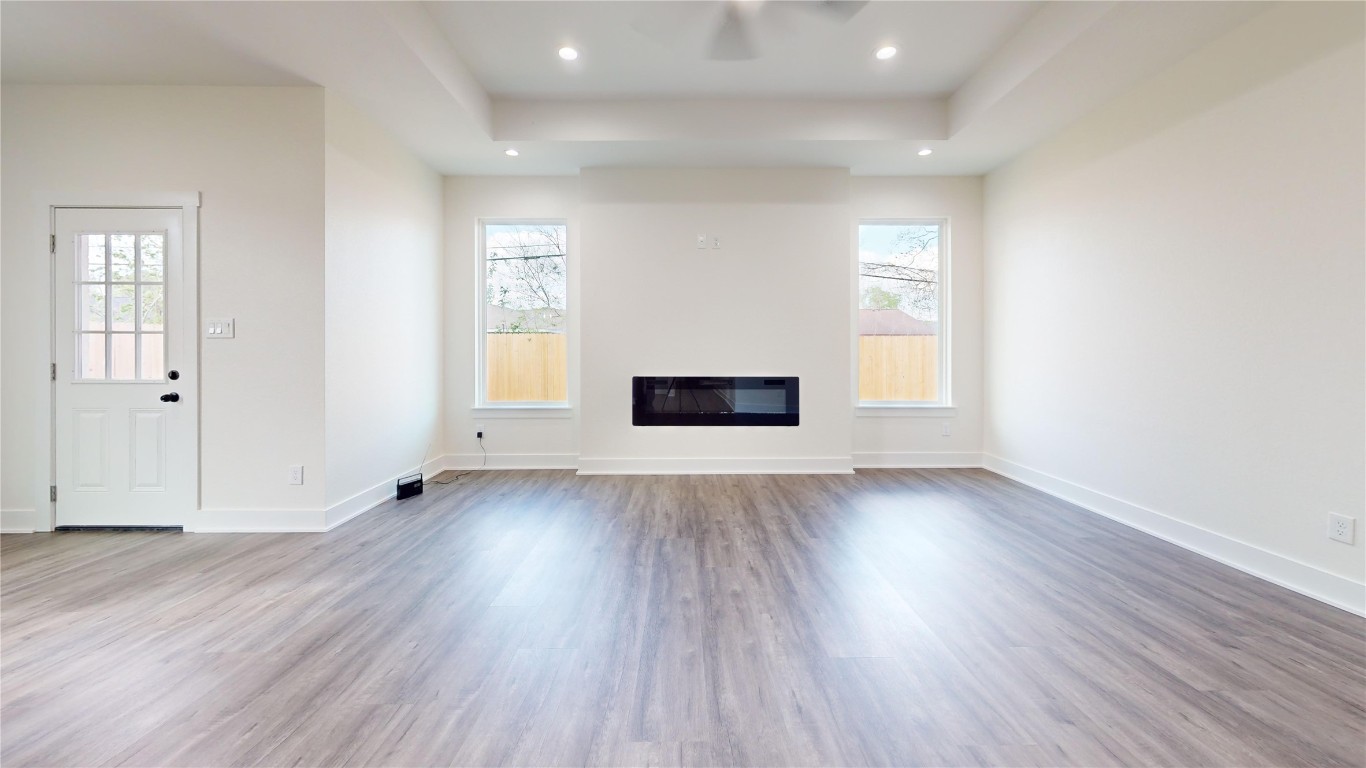 5119 Selinsky Road Houston, TX 77048 - Photo 28 of 45 an empty room with wooden floor and windows
