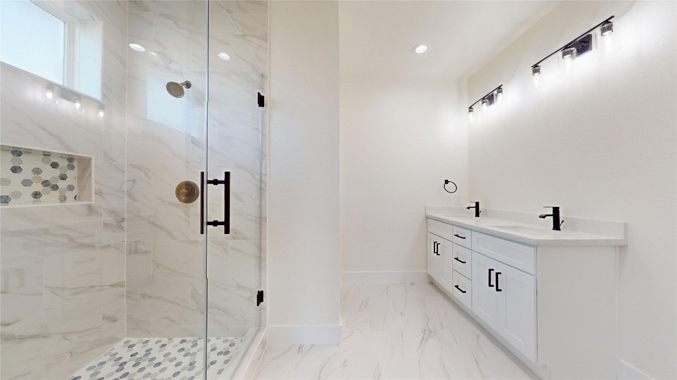 5119 Selinsky Road Houston, TX 77048 - Photo 34 of 45 a bathroom with a bathtub and a shower