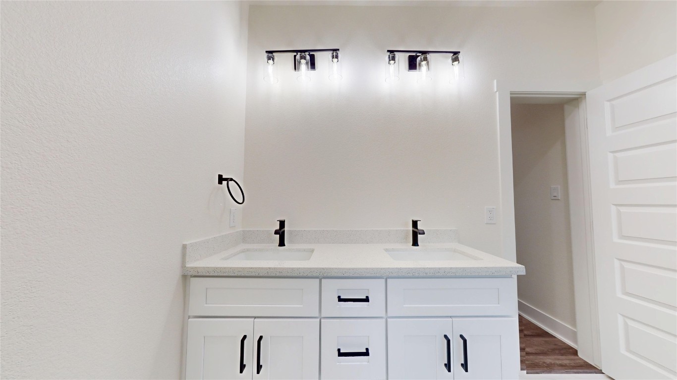 5119 Selinsky Road Houston, TX 77048 - Photo 36 of 45 a bathroom with a sink and a mirror