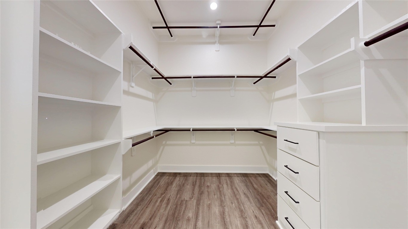 5119 Selinsky Road Houston, TX 77048 - Photo 38 of 45 a view of walk in closet with empty racks