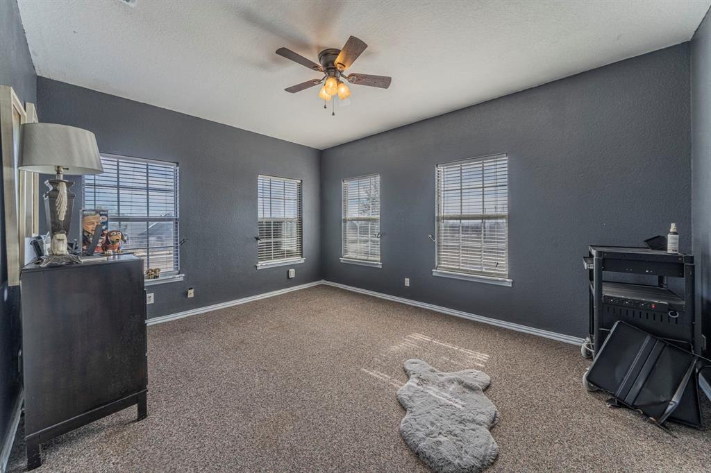 6438 Farm To Market 4 Godley, TX 76044 - Photo 22 of 32 a view of livingroom with workspace and a window