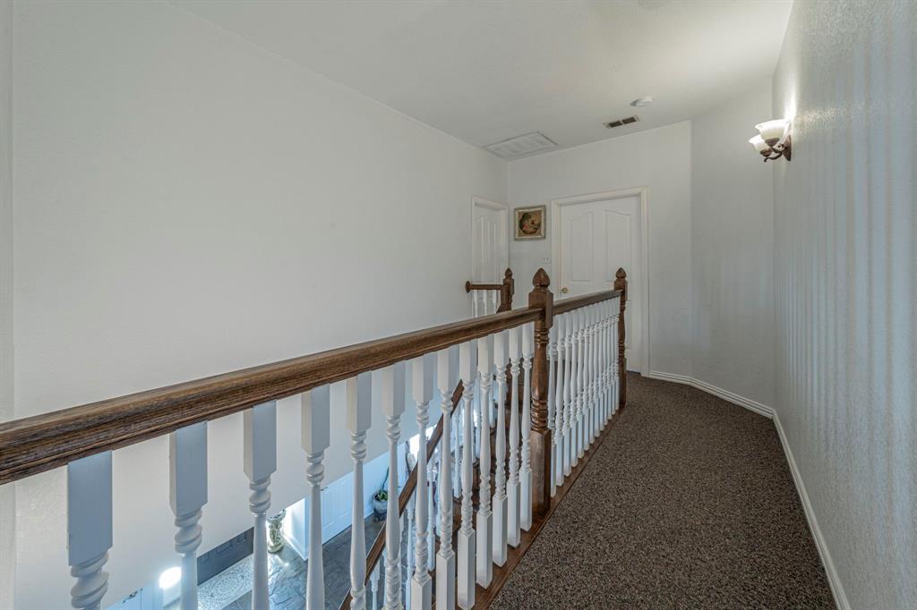 6438 Farm To Market 4 Godley, TX 76044 - Photo 23 of 32 a view of a hallway with wooden floor