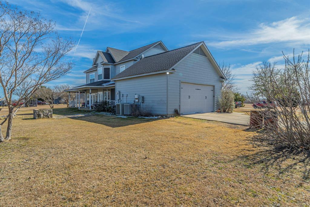 6438 Farm To Market 4 Godley, TX 76044 - Photo 24 of 32 a house with a large tree in front of it