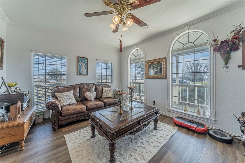 6438 Farm To Market 4 Godley, TX 76044 - Photo 3 of 32 a living room with furniture and wooden floor