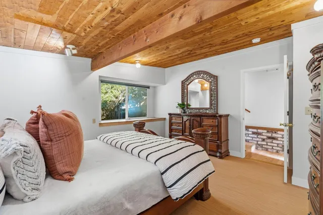 a view of a livingroom with furniture and hardwood floor