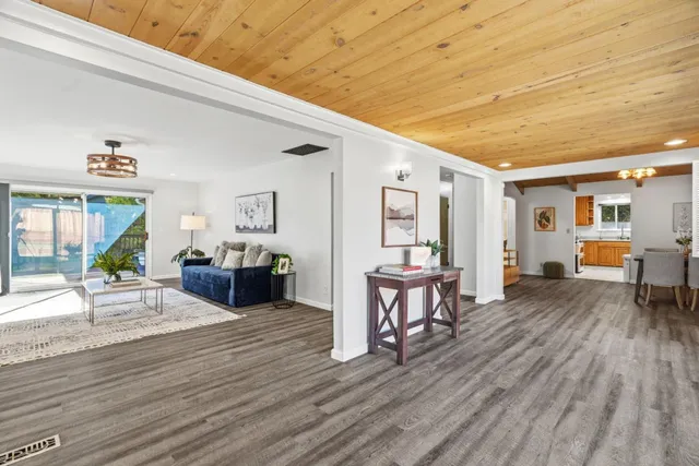 a kitchen with stainless steel appliances a refrigerator and a stove top oven