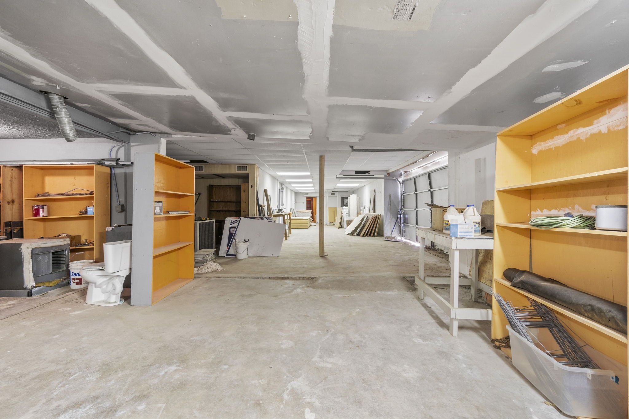 1018 Shaver Street Pasadena, TX 77506 - Photo 43 of 43 Large workshop or storage area with open floor plan and shelving.