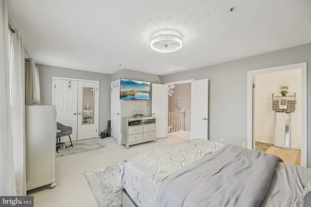 a bedroom with a bed and a cabinets