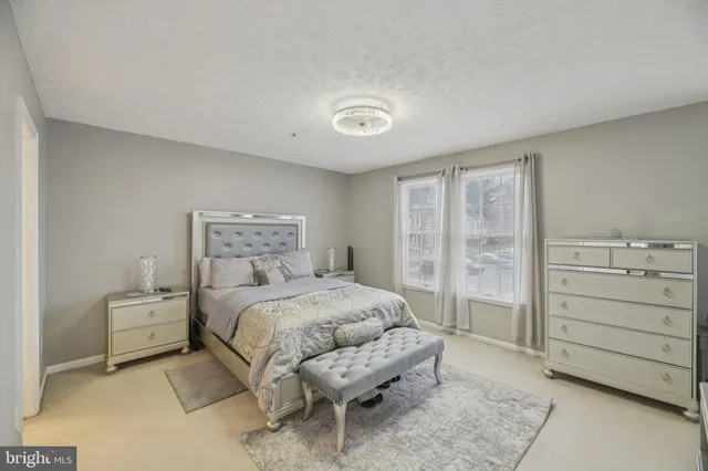 a bedroom with a bed and a cabinets