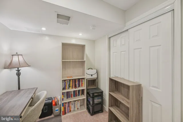 a view of room with cabinet and entryway