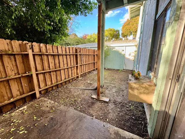 a view of a balcony with wooden floor