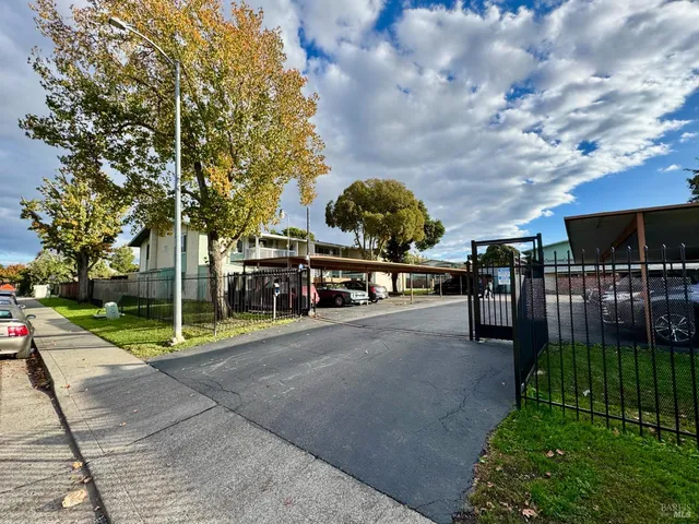 a view of a park with swings and slides
