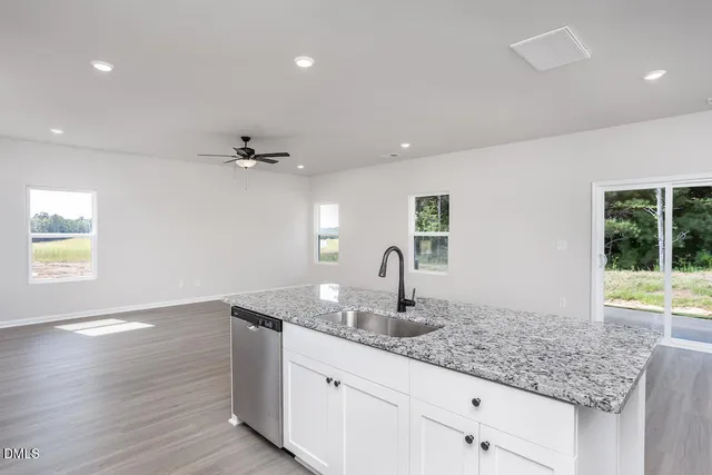a kitchen with sink and window