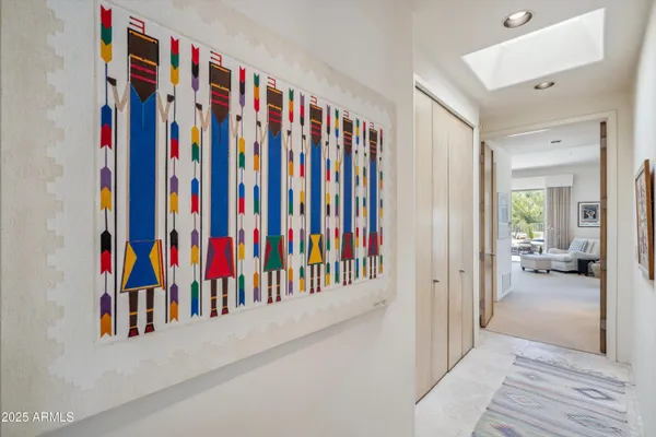 a view of a living room with clothes and shoes