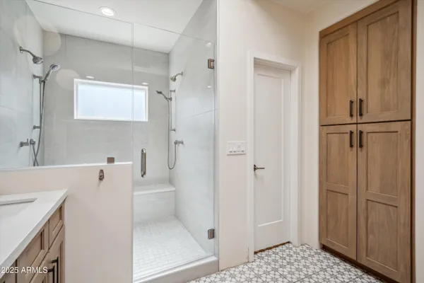 a bathroom with a bathtub a sink a toilet and a shower