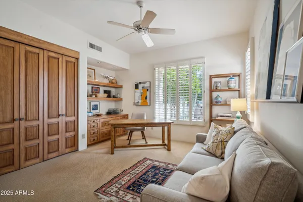 a living room with furniture and a large window