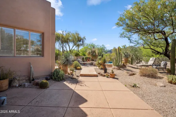 a view of a backyard with sitting area