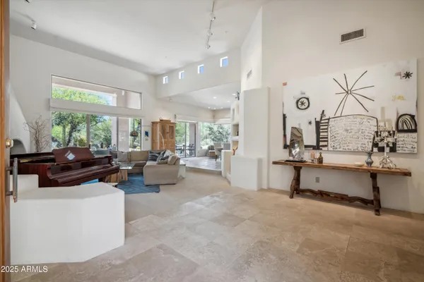 a living room with furniture and a large window