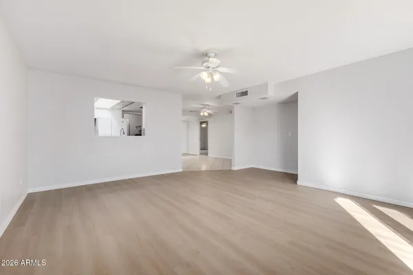 a view of an empty room with a window