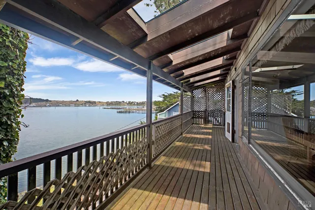 a view of balcony with wooden floor