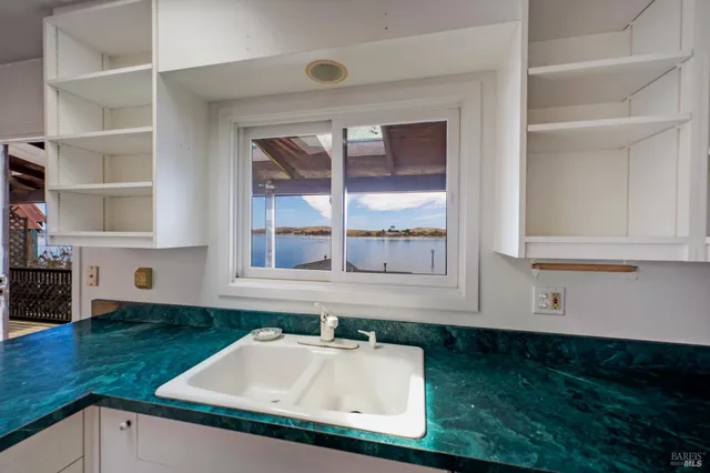 a large living room with furniture and a flat screen tv